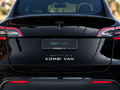 Black Tesla Model Y with I Identify As A Kombi Van white decal