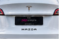 White Tesla Model Y with Mazda decal