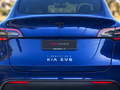 Pop Simple I Identify as a KIA EV6 decal on blue Tesla Model Y — contextual view