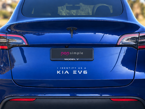 Pop Simple I Identify as a KIA EV6 decal on blue Tesla Model Y — contextual view