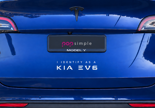 Pop Simple I Identify as a KIA EV6 decal on blue Tesla Model Y — close detail